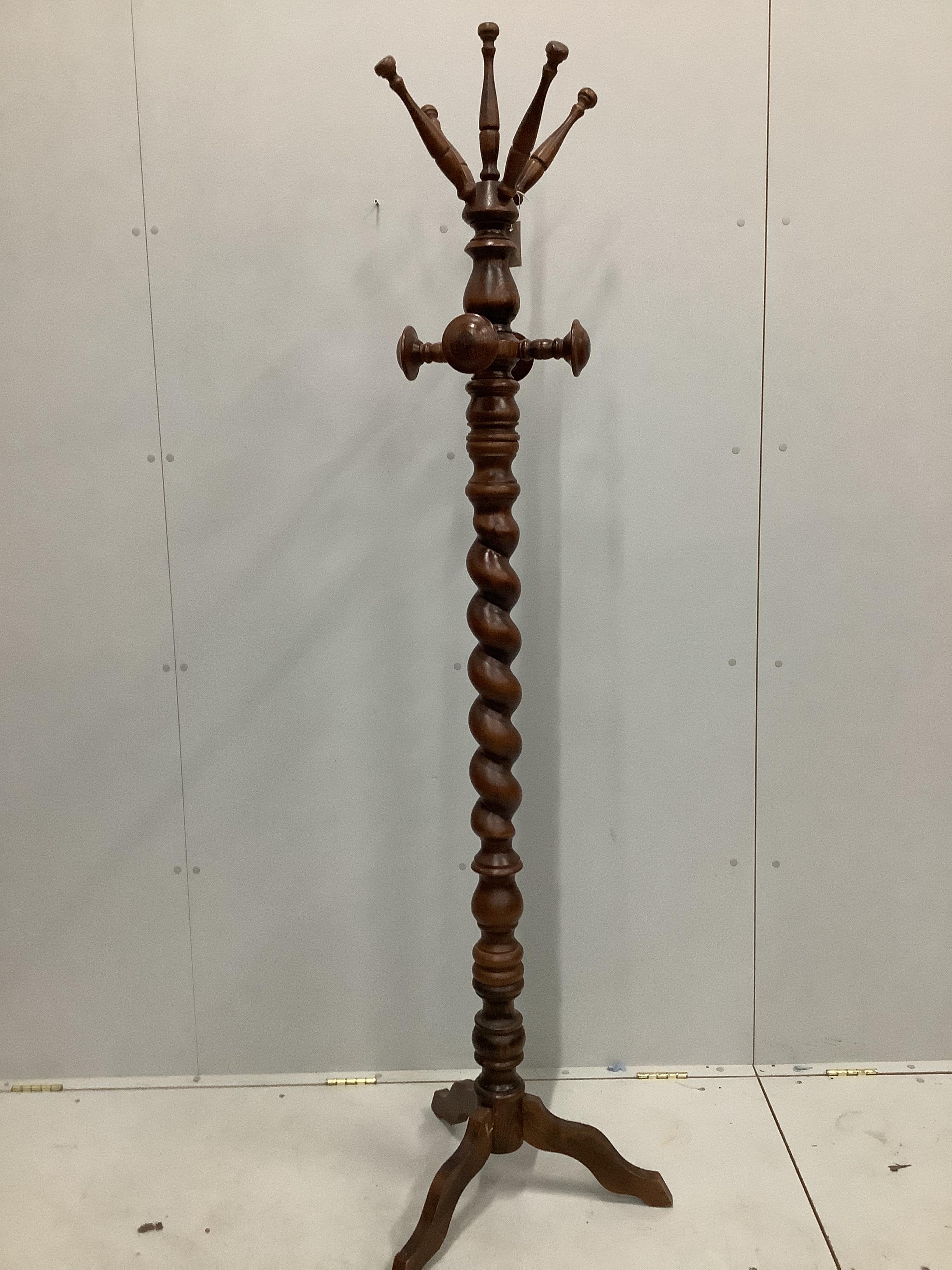 A Victorian style turned beech coat stand, height 200cm
